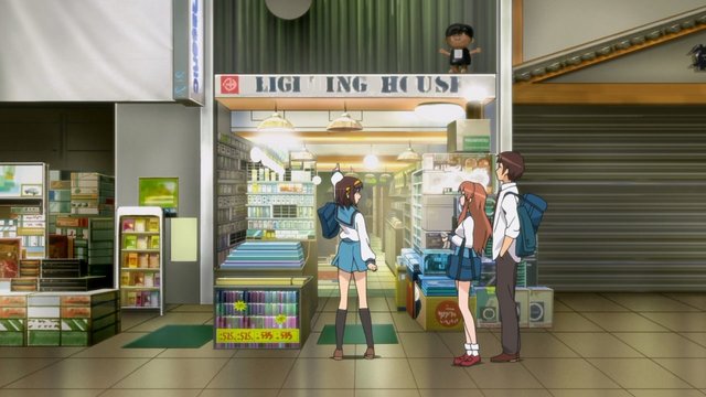 Kyon and Yuki in front of an electronics store
